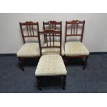 A set of four Edwardian mahogany dining chairs.