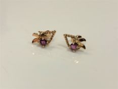 A pair of 9ct gold ruby earrings.