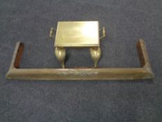 A 19th century brass footman together with a brass fire curb