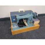 A 20th century Alfa Stitch Line electric sewing machine with accessories,