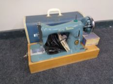 A 20th century Alfa Stitch Line electric sewing machine with accessories,