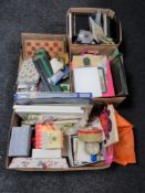 Three boxes of table linen, craft items, note paper,