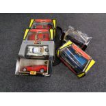 A tray of four Burago 1/25 and 1/24 scale die cast vehicles to include Range Rover, Ferrari,