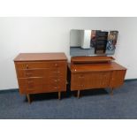 A mid 20th century teak dressing chest together with matching four drawer chest.