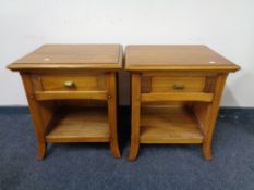 A pair of Chapman's Siesta bedside tables, fitted a drawer.