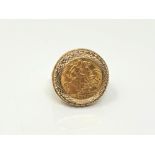 A gent's 9ct gold ring set with a 1911 half sovereign, size T.