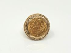 A gent's 9ct gold ring set with a 1911 half sovereign, size T.