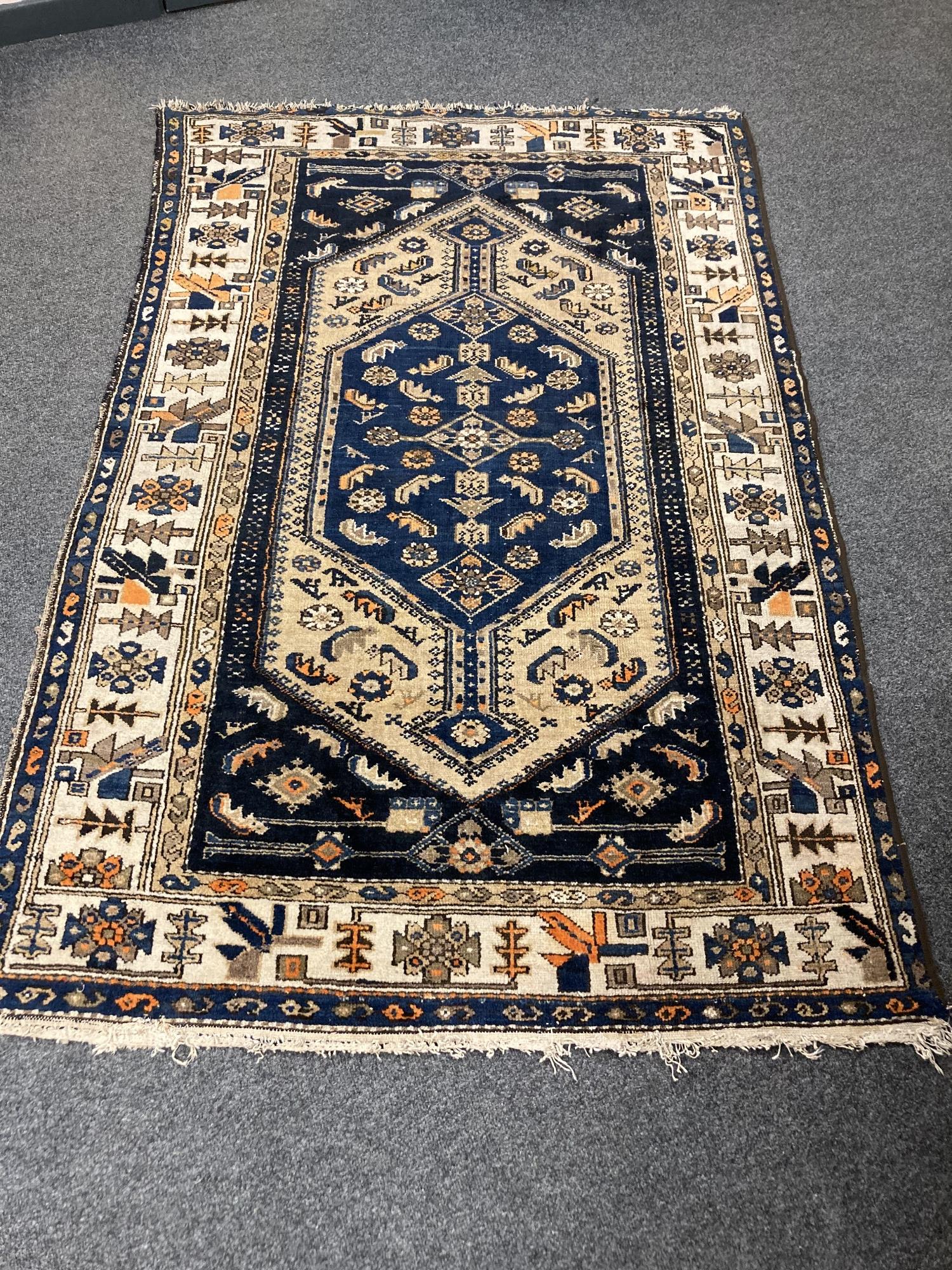 An antique Malayer rug 193 cm x 122 cm