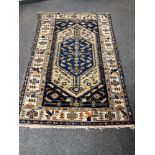 An antique Malayer rug 193 cm x 122 cm