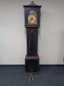 An early 20th century painted continental longcase clock with painted dial, pendulum and weights.