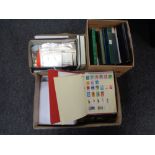 Three boxes containing a large quantity of world stamps and first day covers in albums and folders.