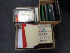 Three boxes containing a large quantity of world stamps and first day covers in albums and folders.