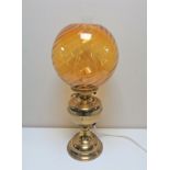 A brass Duplex oil lamp with amber glass shade and chimney (converted)