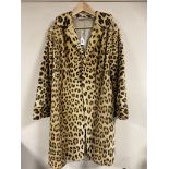 An early 20th century lady's 3/4 length leopard fur coat.