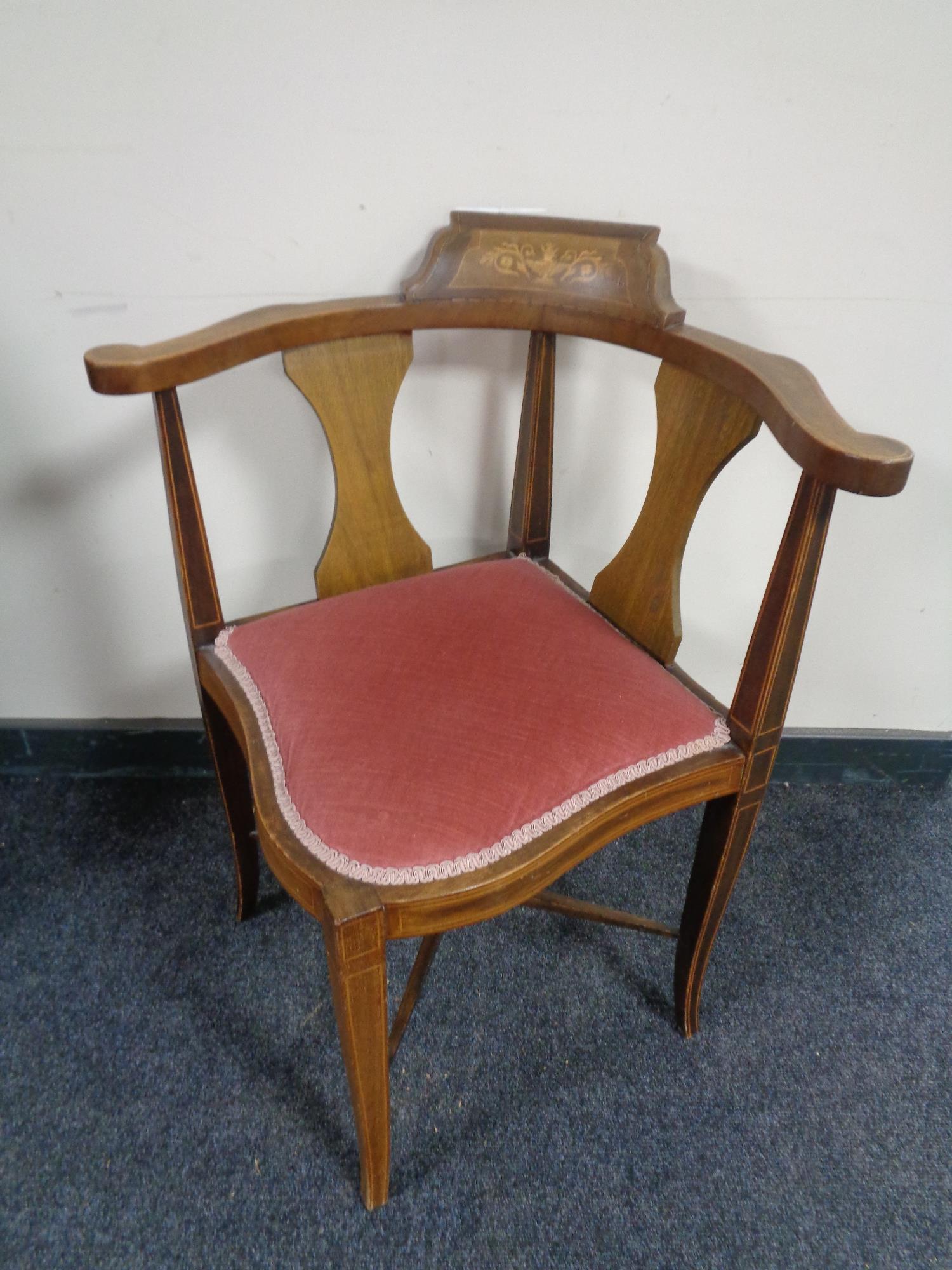 An Edwardian inlaid mahogany corner chair.