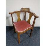 An Edwardian inlaid mahogany corner chair.