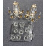 A tray of two five-way brass and glass chandeliers with glass drops and shades