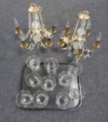 A tray of two five-way brass and glass chandeliers with glass drops and shades