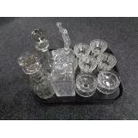 A tray containing assorted glassware to include whiskey and liqueur decanters, dessert bowls,