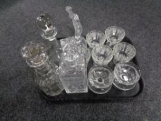 A tray containing assorted glassware to include whiskey and liqueur decanters, dessert bowls,