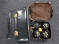 A lawn bowls bag containing four composite Taylor bowls and a leather briefcase