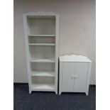 A set of contemporary open bookshelves together with matching double door cabinets (white).