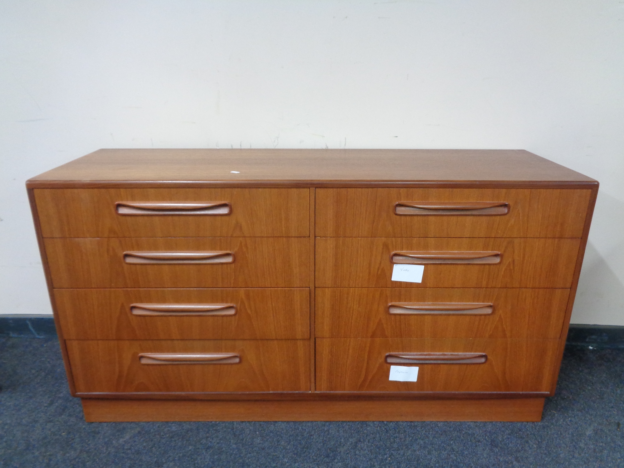 A 20th century teak G Plan eight drawer chest.