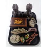 A tray containing musical jewellery box, carved hardwood African figures, tourist soapstone pieces,