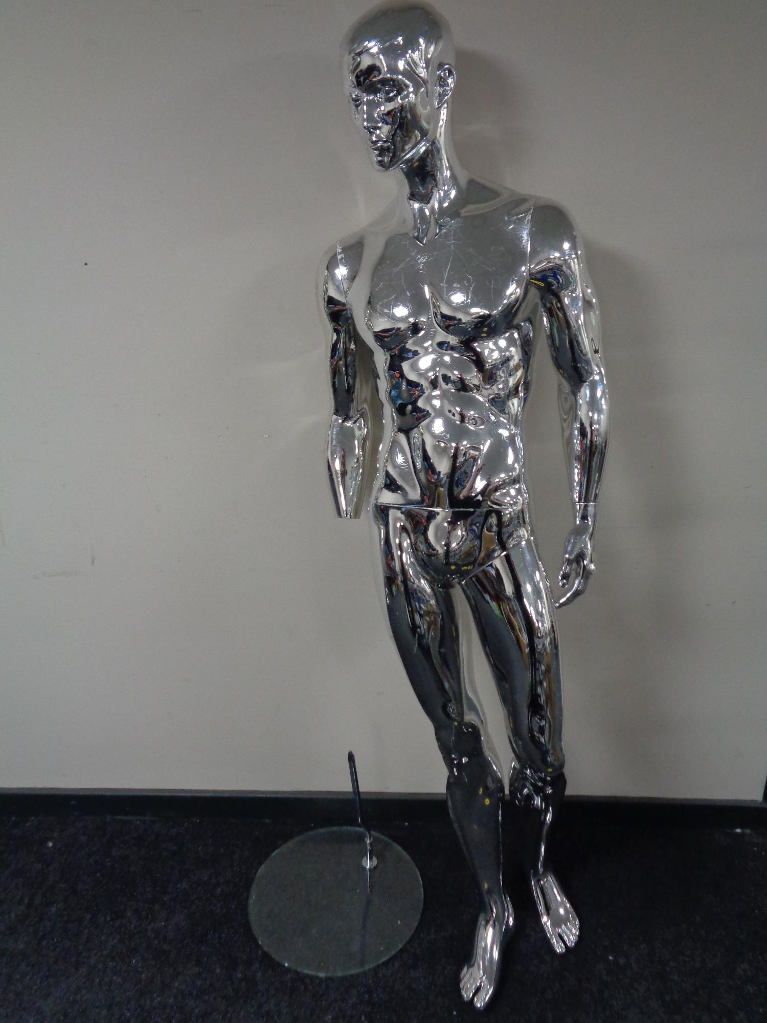 A male shop mannequin on glass stand (silver,