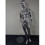 A male shop mannequin on glass stand (silver,