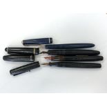 A Watermans fountain pen, a Parker Slimfold fountain pen and a Swan fountain pen,