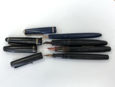 A Watermans fountain pen, a Parker Slimfold fountain pen and a Swan fountain pen,