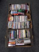 Three boxes containing DVDs, DVD box sets etc.