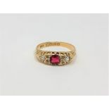 An 18ct gold diamond and garnet ring, size O CONDITION REPORT: 2.