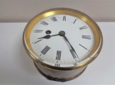 A circular brass cased ship's clock