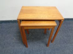 A nest of two mid 20th century teak A. H. McIntosh tables.