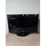 An LG 32 inch LCD TV with lead