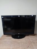 An LG 32 inch LCD TV with lead