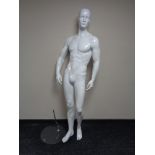 A male shop mannequin on glass stand (white)