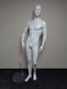 A male shop mannequin on glass stand (white)