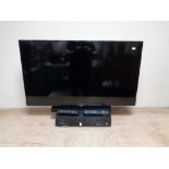 A Samsung 40 inch LCD TV with remote together with a Panasonic DVD/VCR with remote