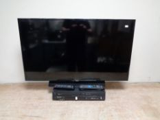 A Samsung 40 inch LCD TV with remote together with a Panasonic DVD/VCR with remote