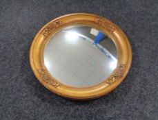 An early twentieth century gilt framed composite porthole mirror