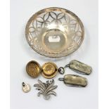 A brass sovereign case, a silver brooch, a silver plated pierced bowl,