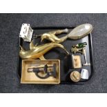 A tray containing a boxed Student microscope, brass figure of dolphins, plated backed hairbrush,