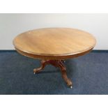 A Victorian mahogany circular pedestal breakfast table.