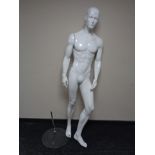 A male shop mannequin on glass stand (white)