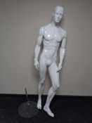 A male shop mannequin on glass stand (white)