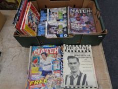 A box containing football annuals, late 20th century Newcastle United programmes,