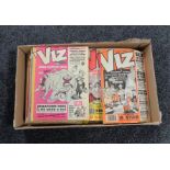 A box containing vintage Viz comics.